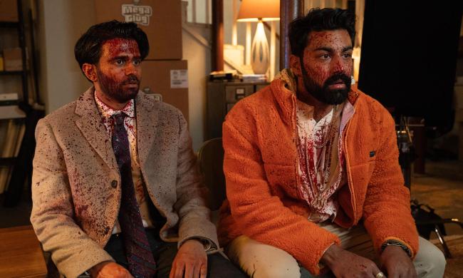 Two men splattered with blood; Asif Ali and Saagar Shaikh in 'Deli Boys'