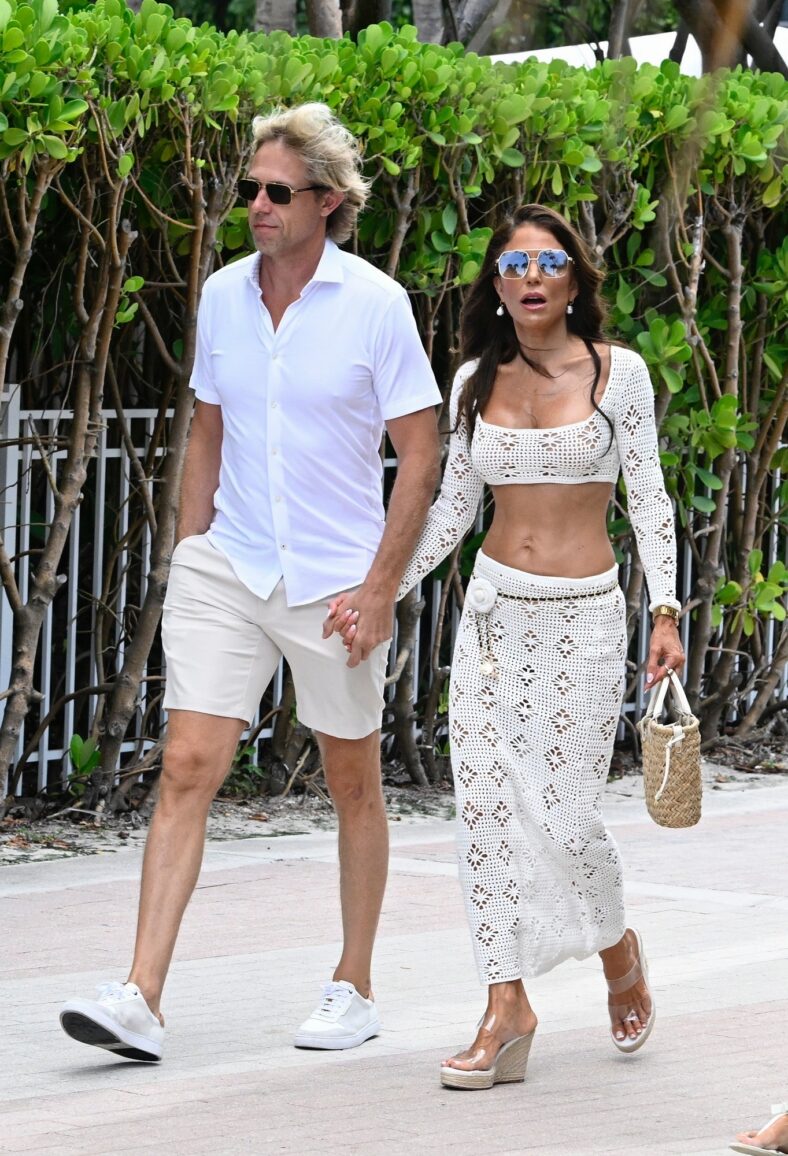 Shane Campbell and Bethenny Frankel hold hands