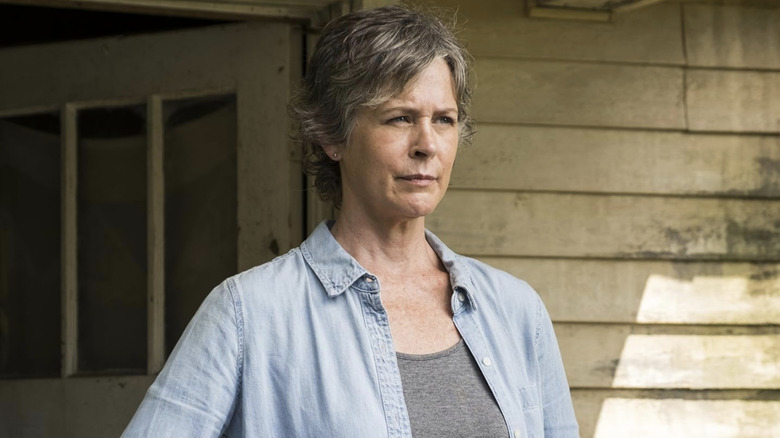 Carol looking into the distance wearing a light blue shirt