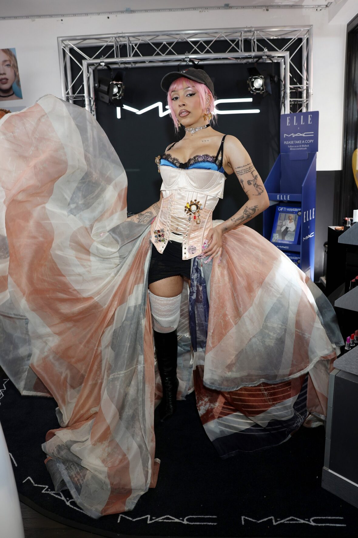 Doja Cat wears Union Jack skirt and corset in London for MAC Cosmetics launch