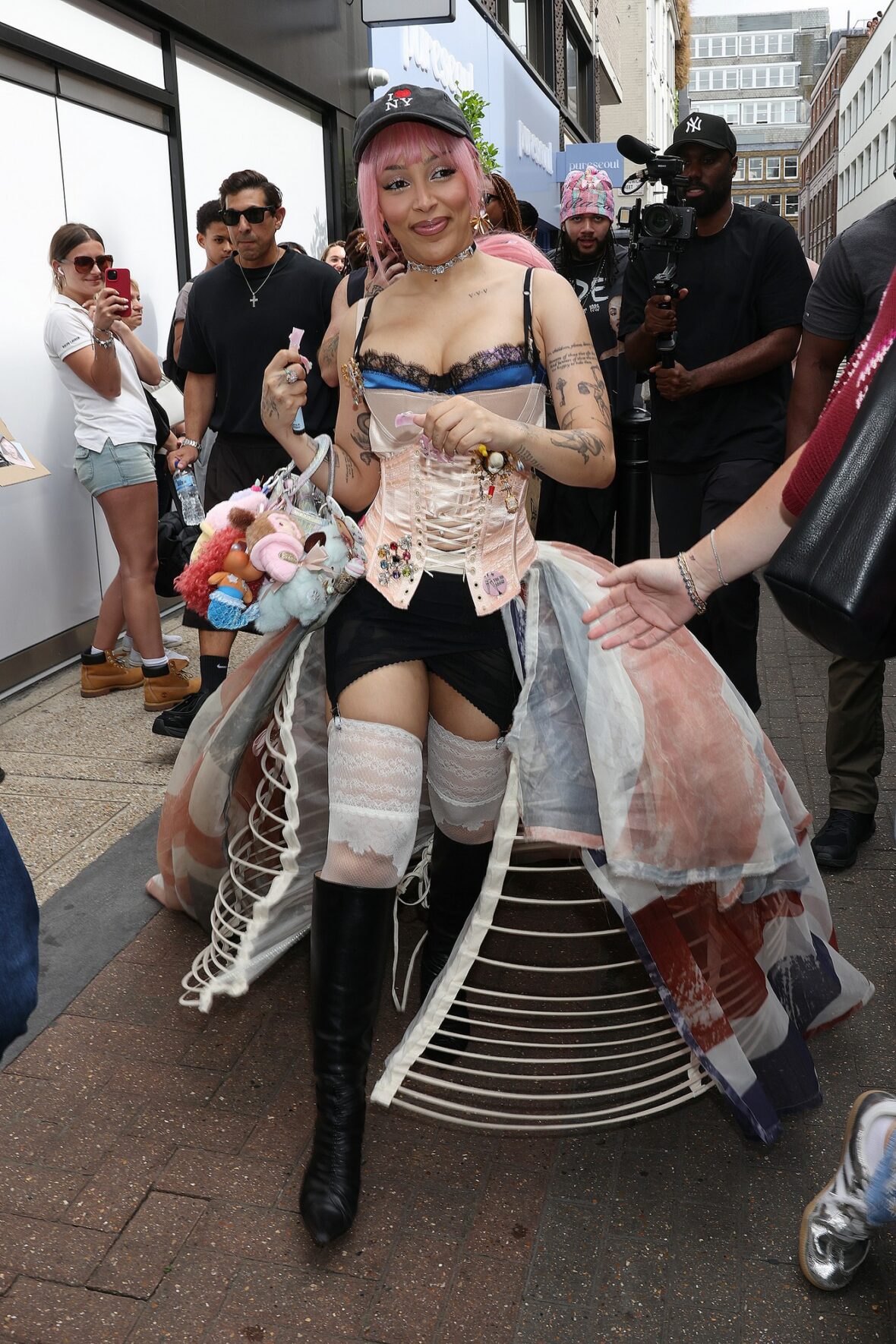 Doja Cat wears Union Jack skirt and corset in London for MAC Cosmetics launch