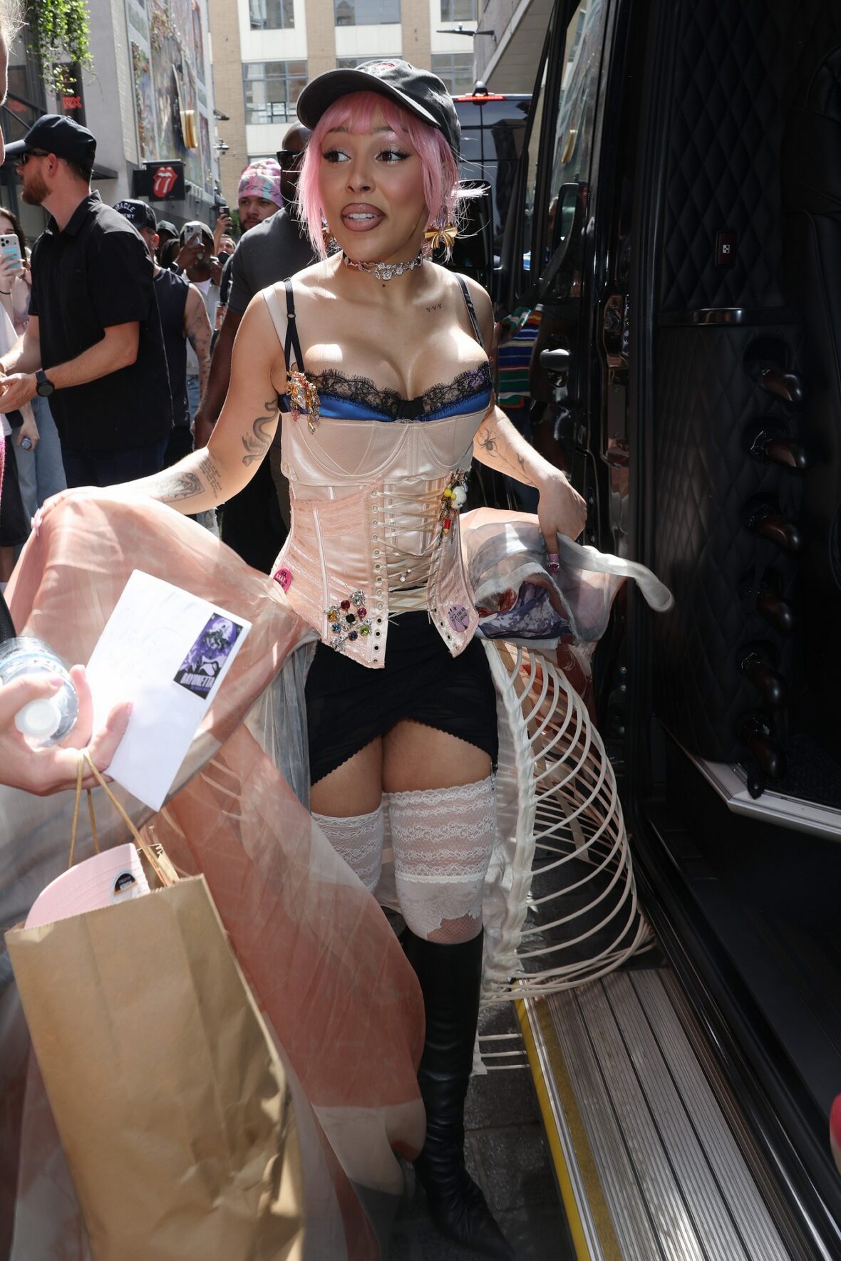 Doja Cat wears Union Jack skirt and corset in London for MAC Cosmetics launch