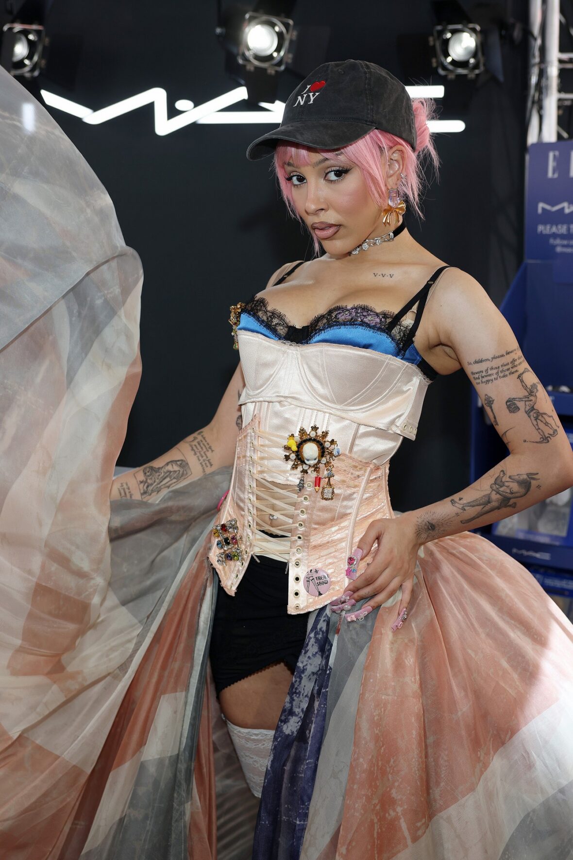 Doja Cat wears Union Jack skirt and corset in London for MAC Cosmetics launch