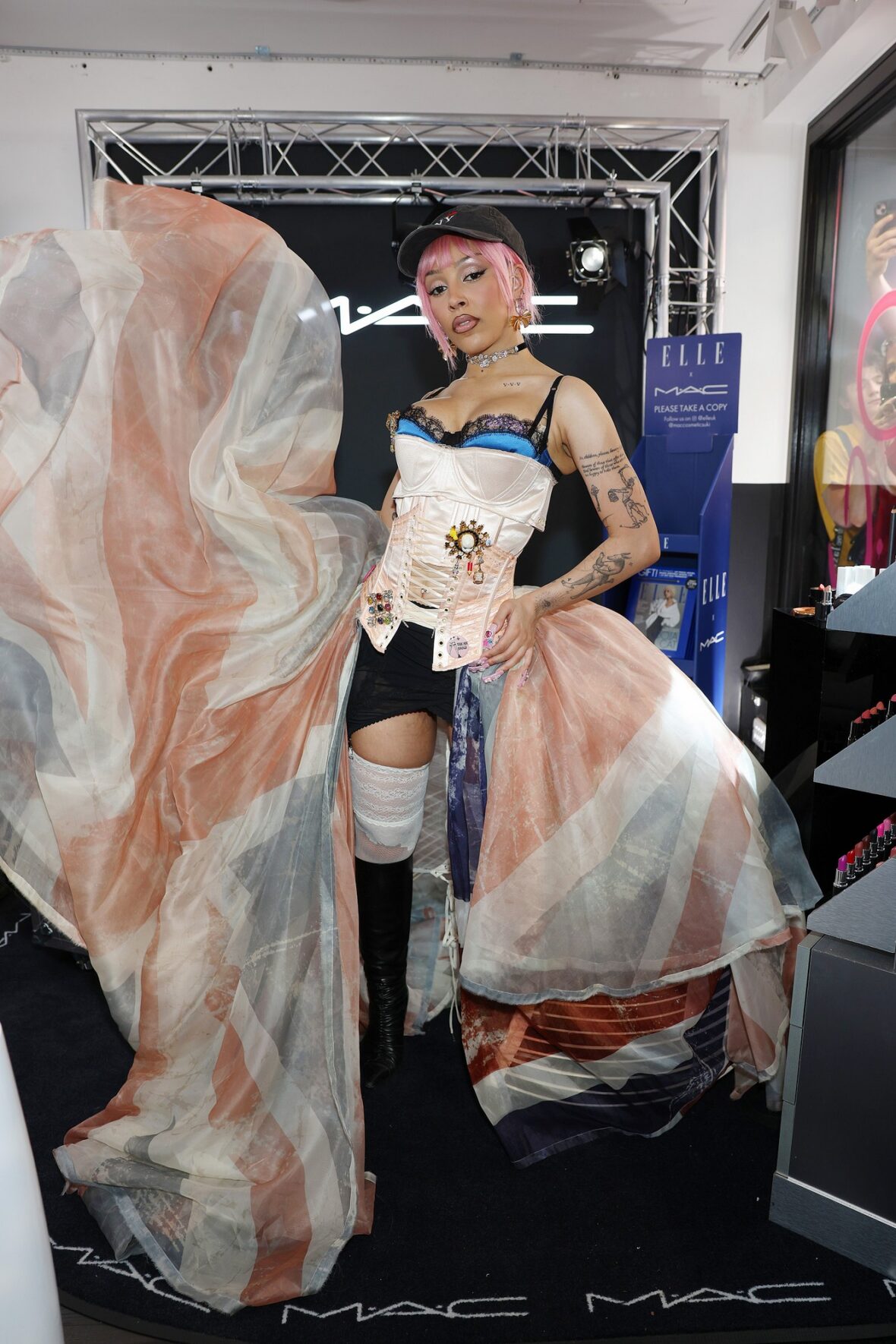 Doja Cat wears Union Jack skirt and corset in London for MAC Cosmetics launch