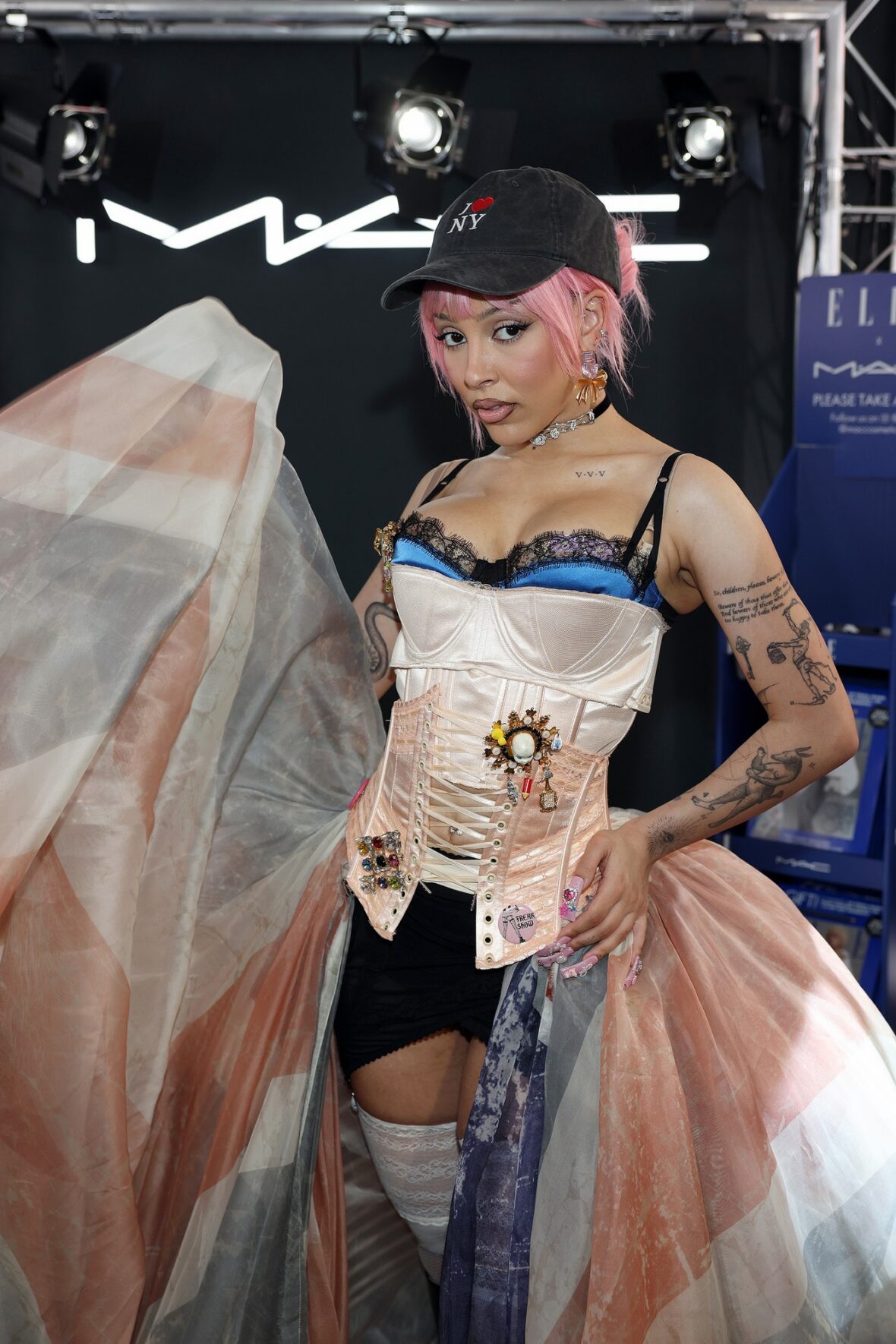 Doja Cat wears Union Jack skirt and corset in London for MAC Cosmetics launch