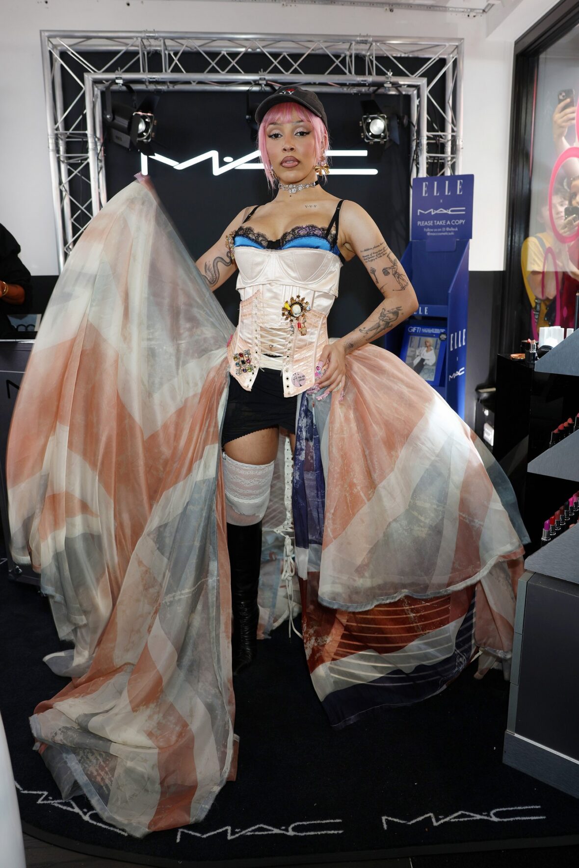 Doja Cat wears Union Jack skirt and corset in London for MAC Cosmetics launch