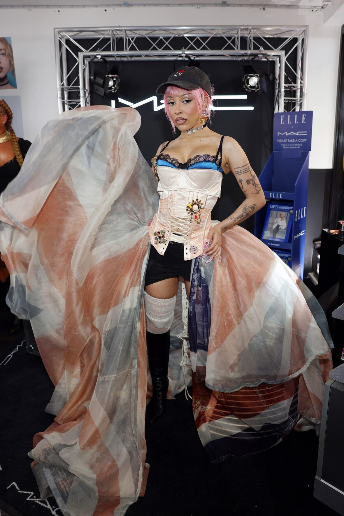 Doja Cat wears Union Jack skirt and corset in London for MAC Cosmetics launch