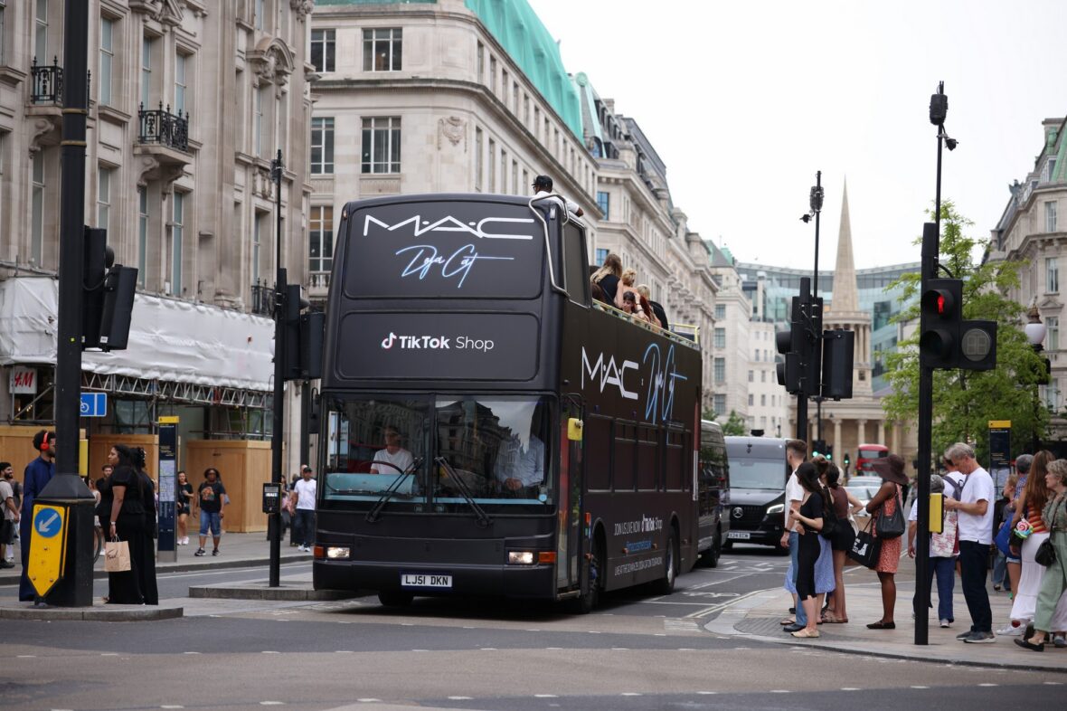 Doja Cat wears a corset and baseball cap to MAC activation in London
