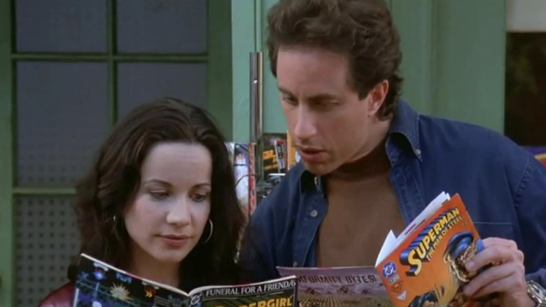 Jeannie Steinman and Jerry Seinfeld looking at comic books together