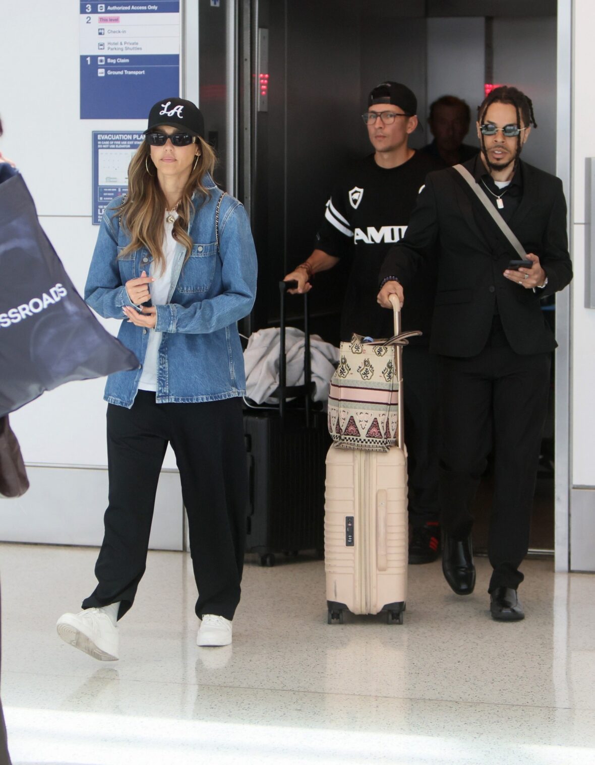 Jessica Alba and Danny Ramirez walking together at LAX