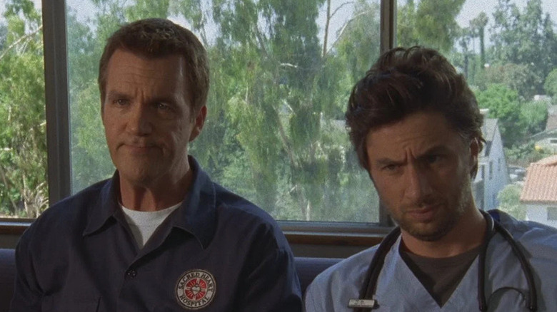 Janitor (Neil Flynn) sitting next to JD (Zach Braff) on 