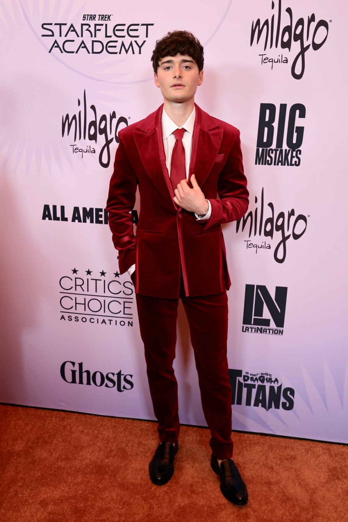Noah Schnapp posing on the red carpet at the Celebration of LGBTQ+ Cinema & Television