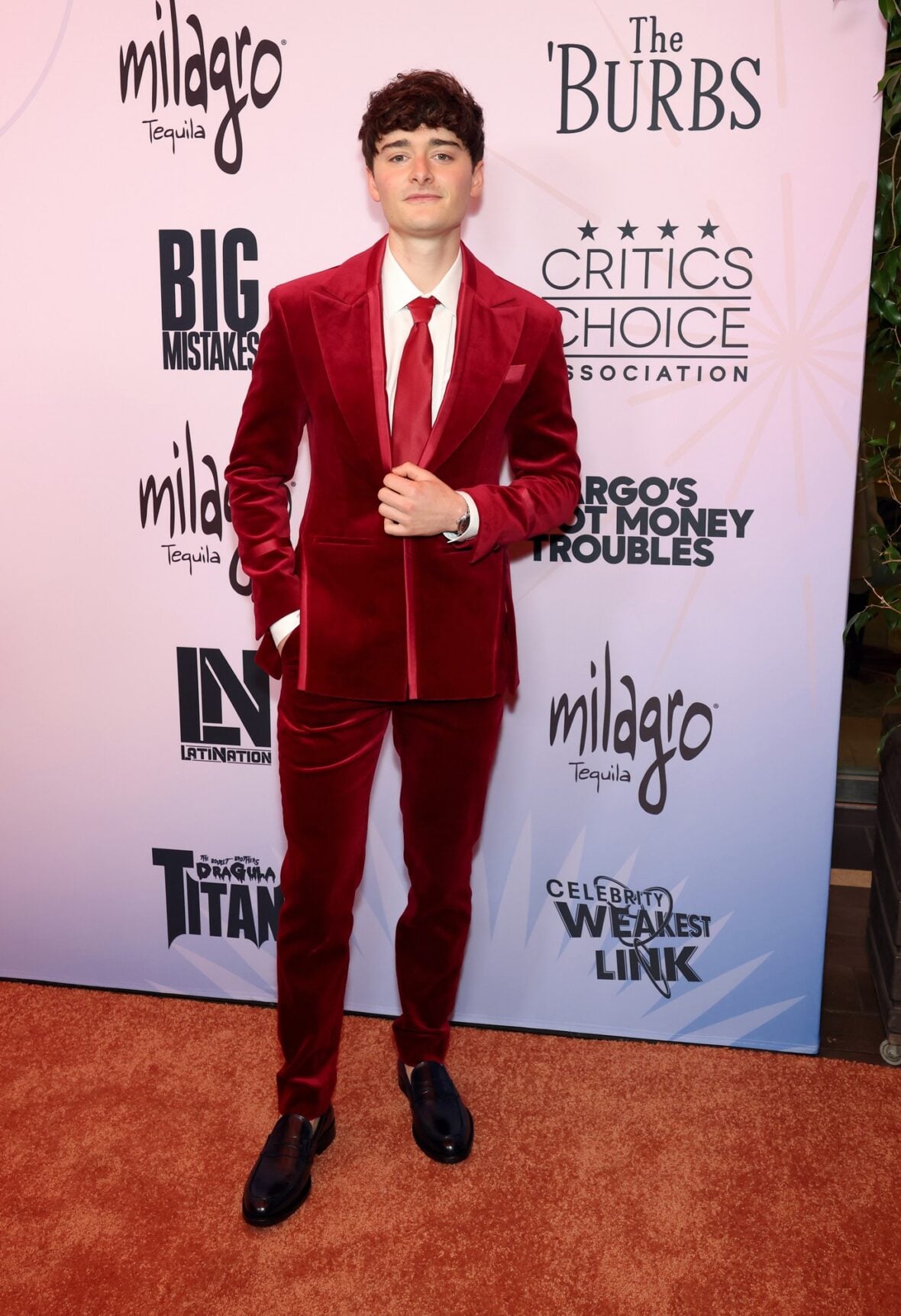 Noah Schnapp posing on the red carpet at the Celebration of LGBTQ+ Cinema & Television