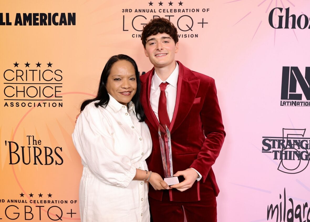 Noah Schnapp and Jazz Tangcay posing on the red carpet at the Celebration of LGBTQ+ Cinema & Television