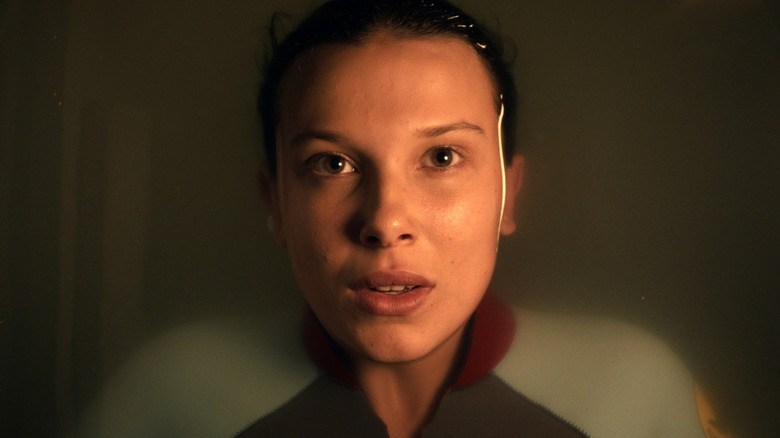 Closeup of Eleven laying in a pool of water