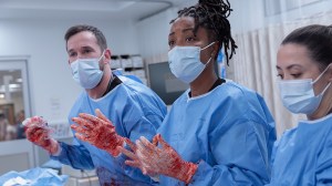 'The Pitt' Season 2 Episode 15 stars Noah Wyle as Dr. Robby and Ayesha Harris as Dr. Ellis, shown mid-operation in the Season 2 finale