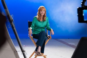 'The Comeback' Season 3, one of the best series of 2026, stars Lisa Kudrow as Valerie Cherish, shown here sitting in a directors chair for an interview, smiling