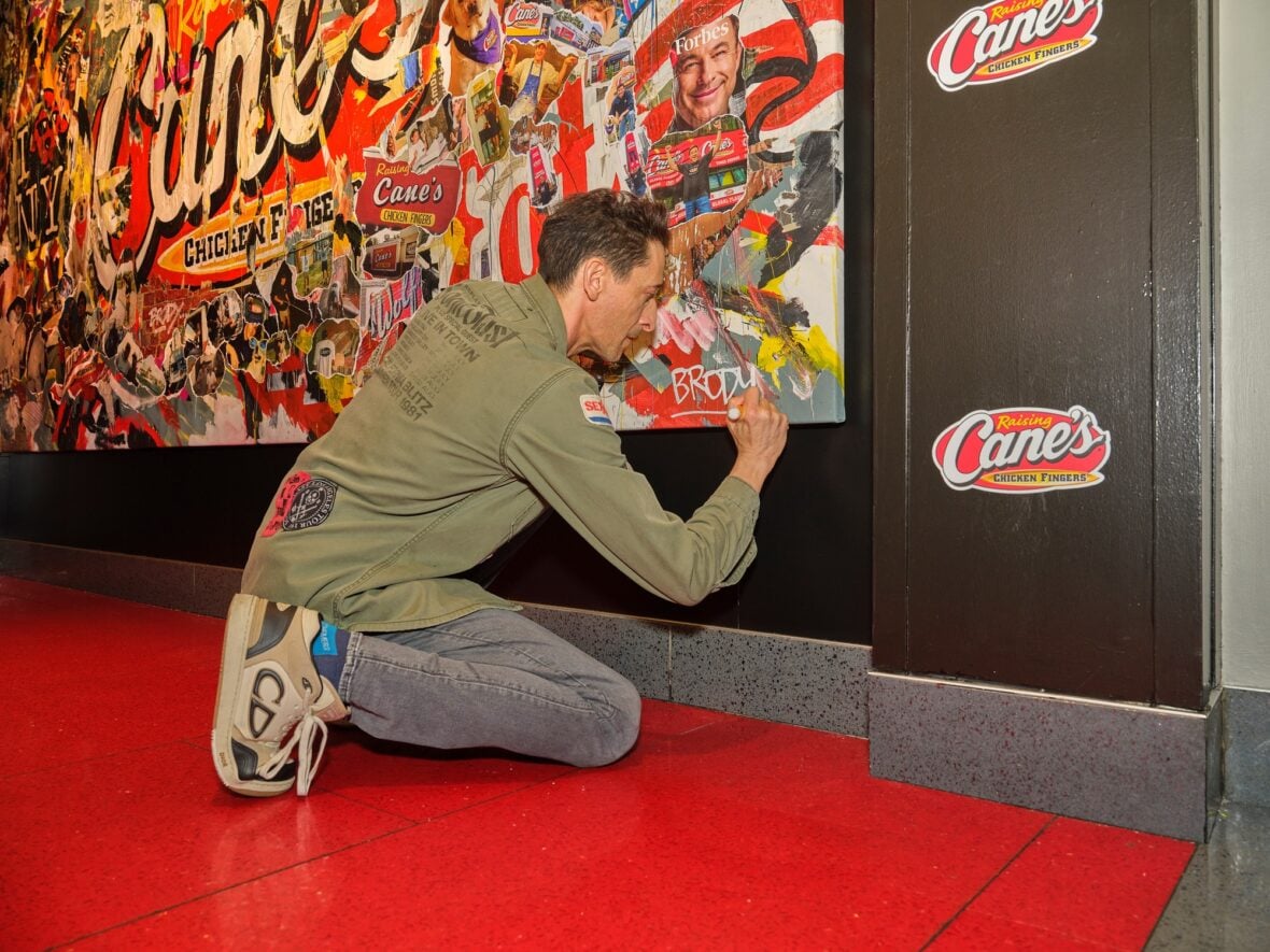 Adrien Brody designs mural for Raising Cane's
