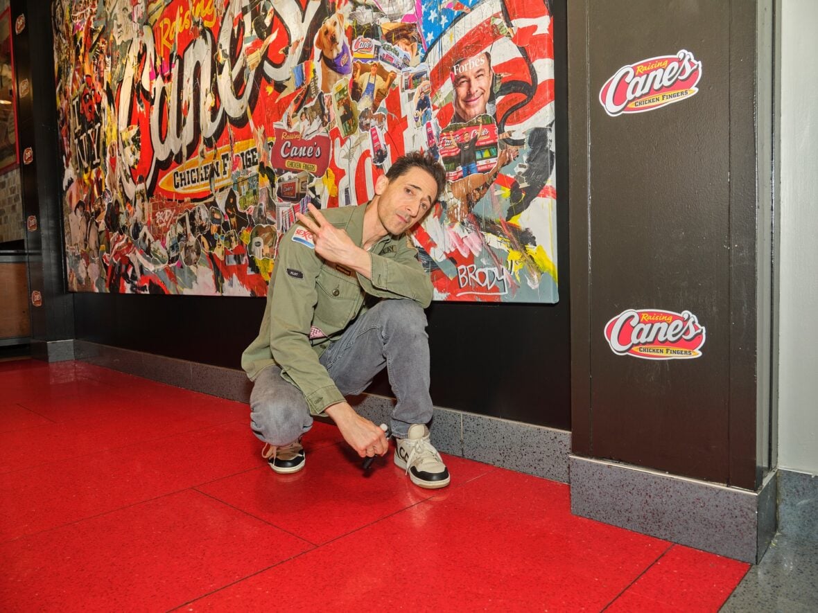 Adrien Brody designs mural for Raising Cane's