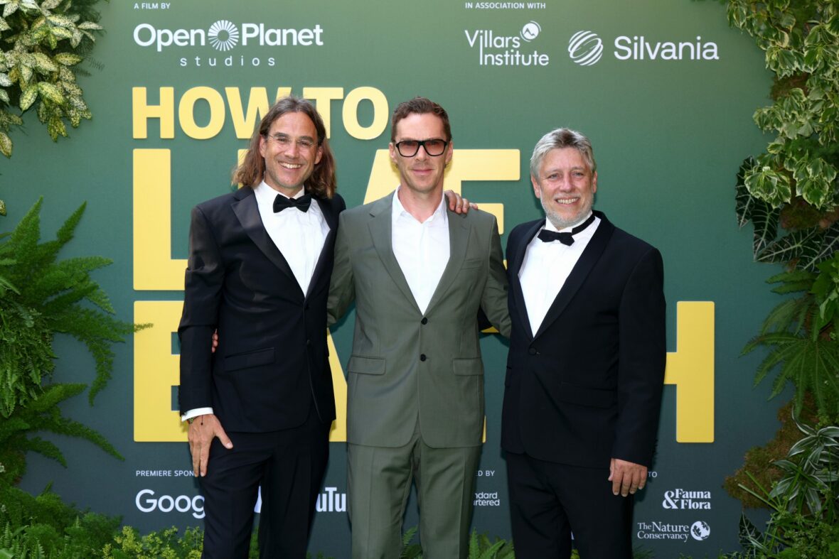Fredi Devas, Benedict Cumberbatch and Jonnie Hughes pose for photos on the world premiere red carpet of "How to Live on Earth"