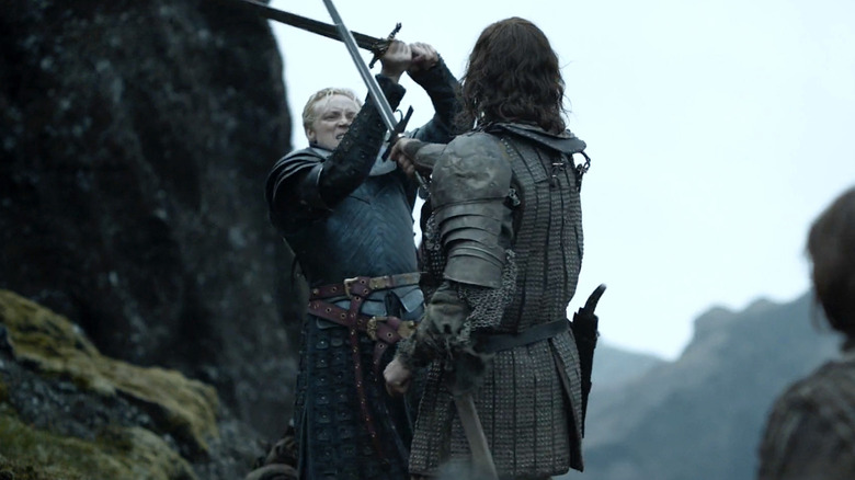 Gwendoline Christie and Rory McCann swordfighting as Brienne of Tarth and The Hound in 