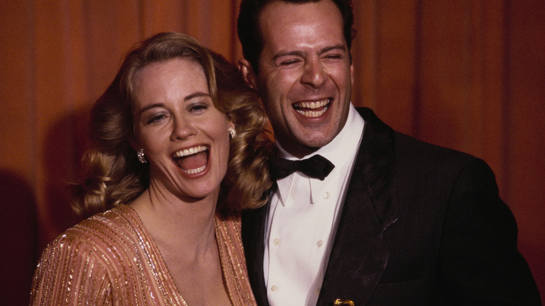 Bruce Willis and Cybill Shepherd celebrating an awards win for Moonlighting