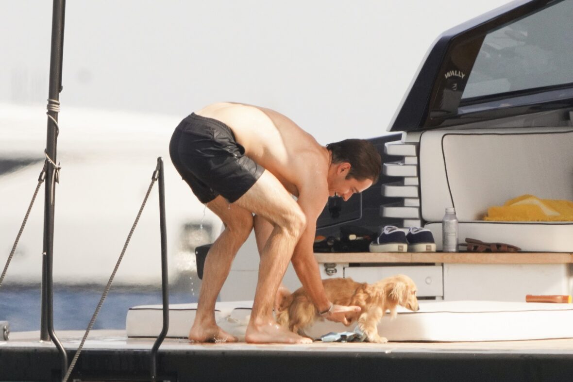 Charles Leclerc and pup Leo aboard a boat in Saint-Tropez