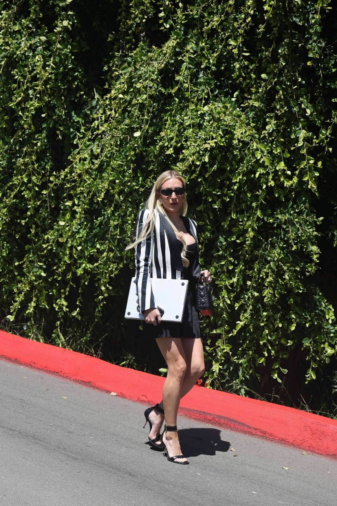 Tara Burns arriving at the Oppenheim Group office in LA
