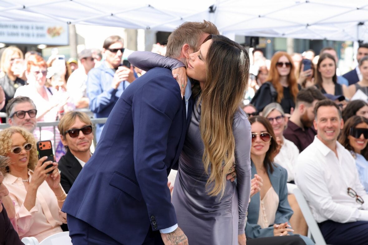 David Beckham hugs Victoria Beckham at his star ceremony