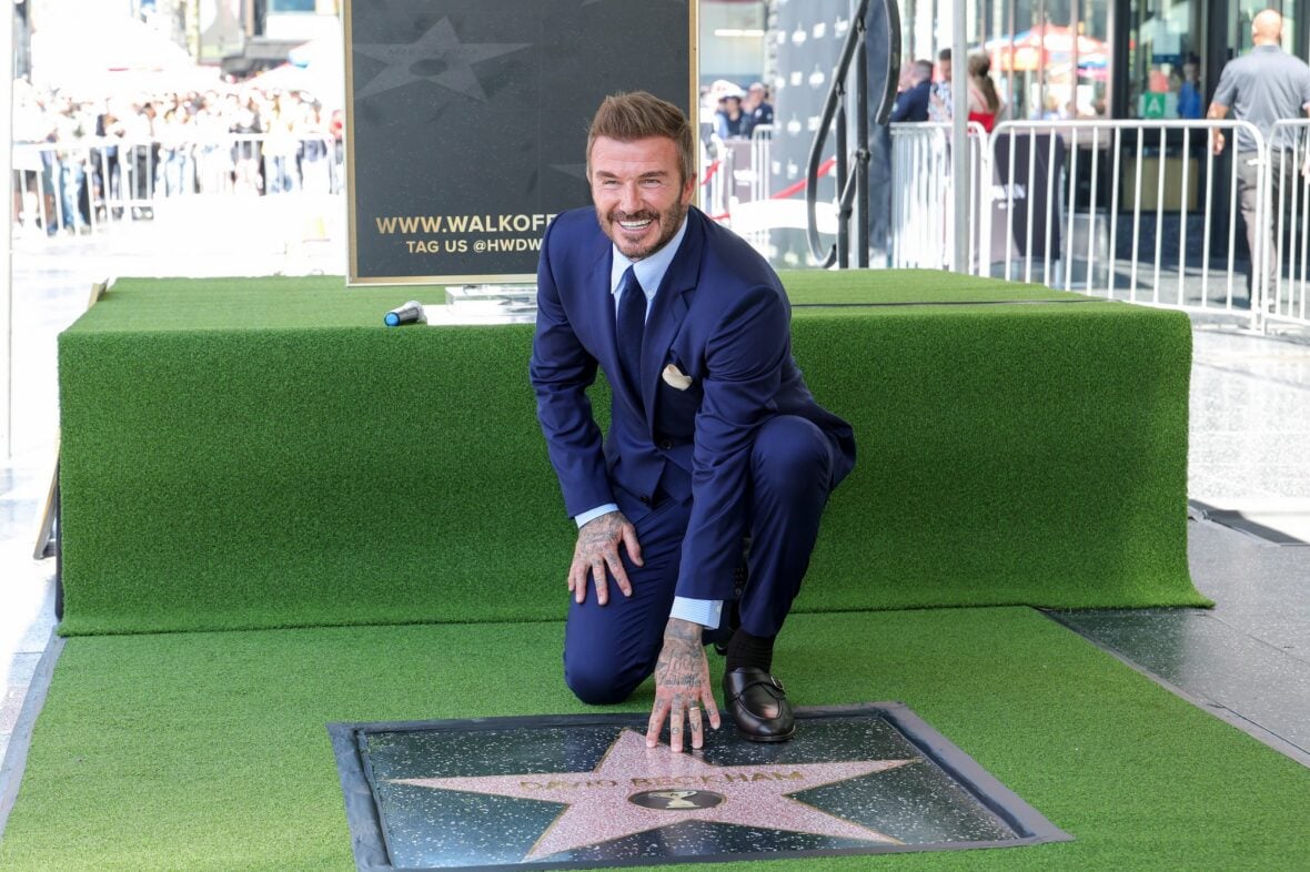 David Beckham poses with his star on the walk of fame