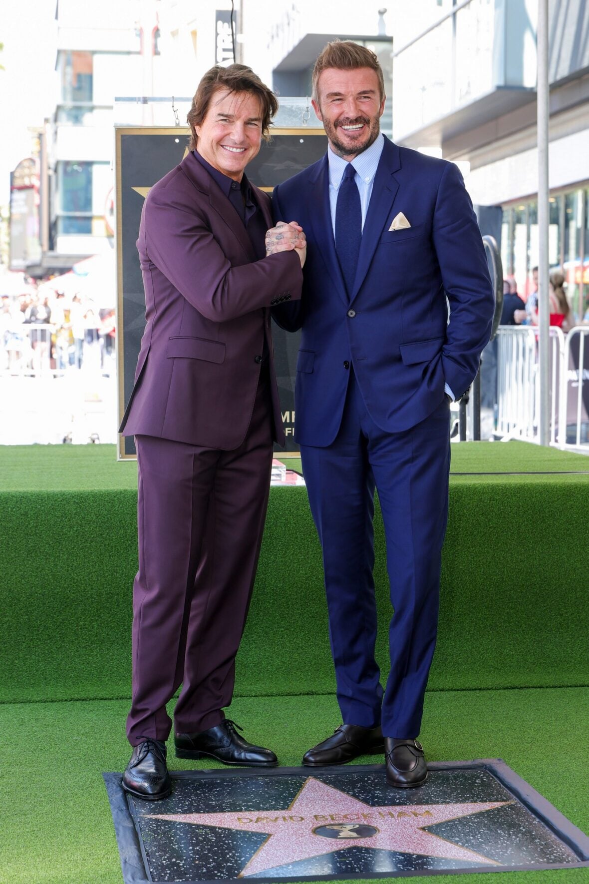Tom Cruise poses with David Beckham at his star ceremony