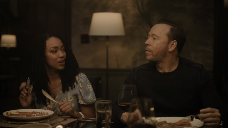 Lena Silver and Danny Reagan looking at each other during a Silver family Shabbat dinner