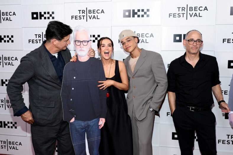 Ken Marino, Zoey Deutch, and Miles Gutierrez-Riley pose with a cardboard cutout of John Slattery at the "Gail Daughtry And The Celebrity Sex Pass" Premiere during the 2026 Tribeca Festival