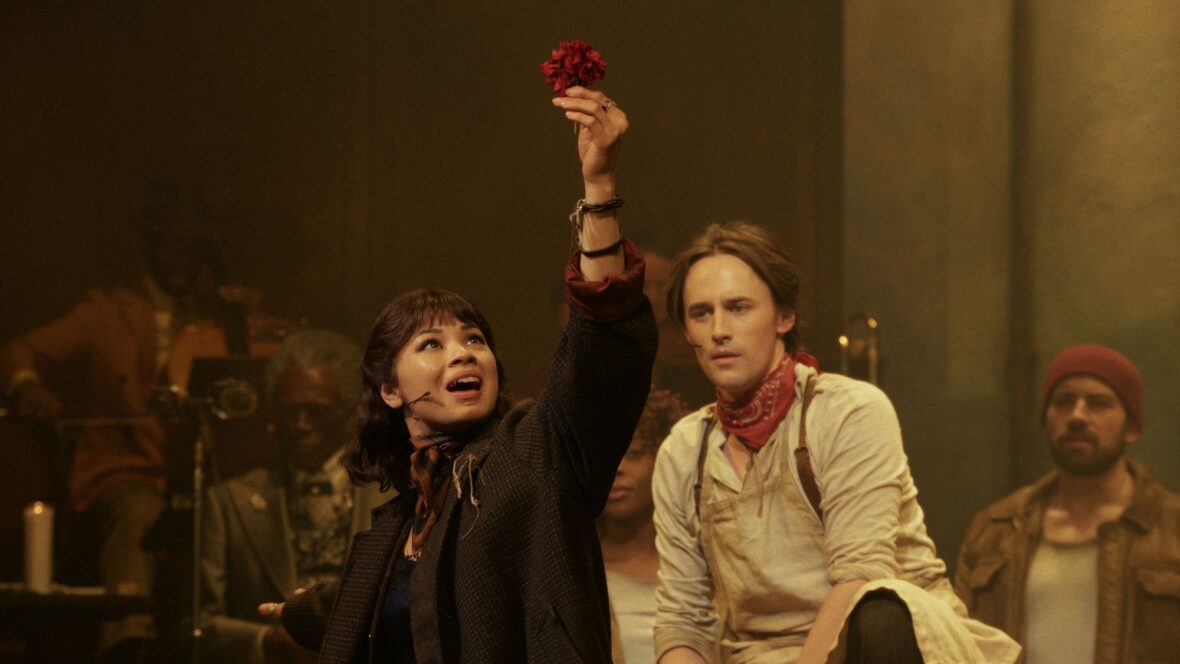 Hadestown pro shot movie still featuring Eva Noblezada and Reeve Carney