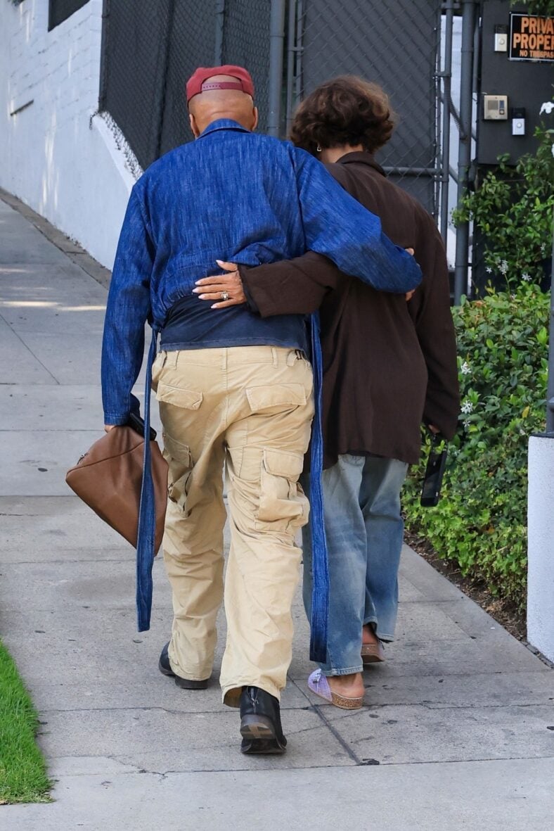 Halle Berry and fiancé Van Hunt share a sweet moment while walking together in West Hollywood, with Van placing his arm around Halle