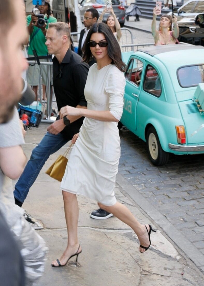 Kendall Jenner in a white midi dress at Anua Skincare event