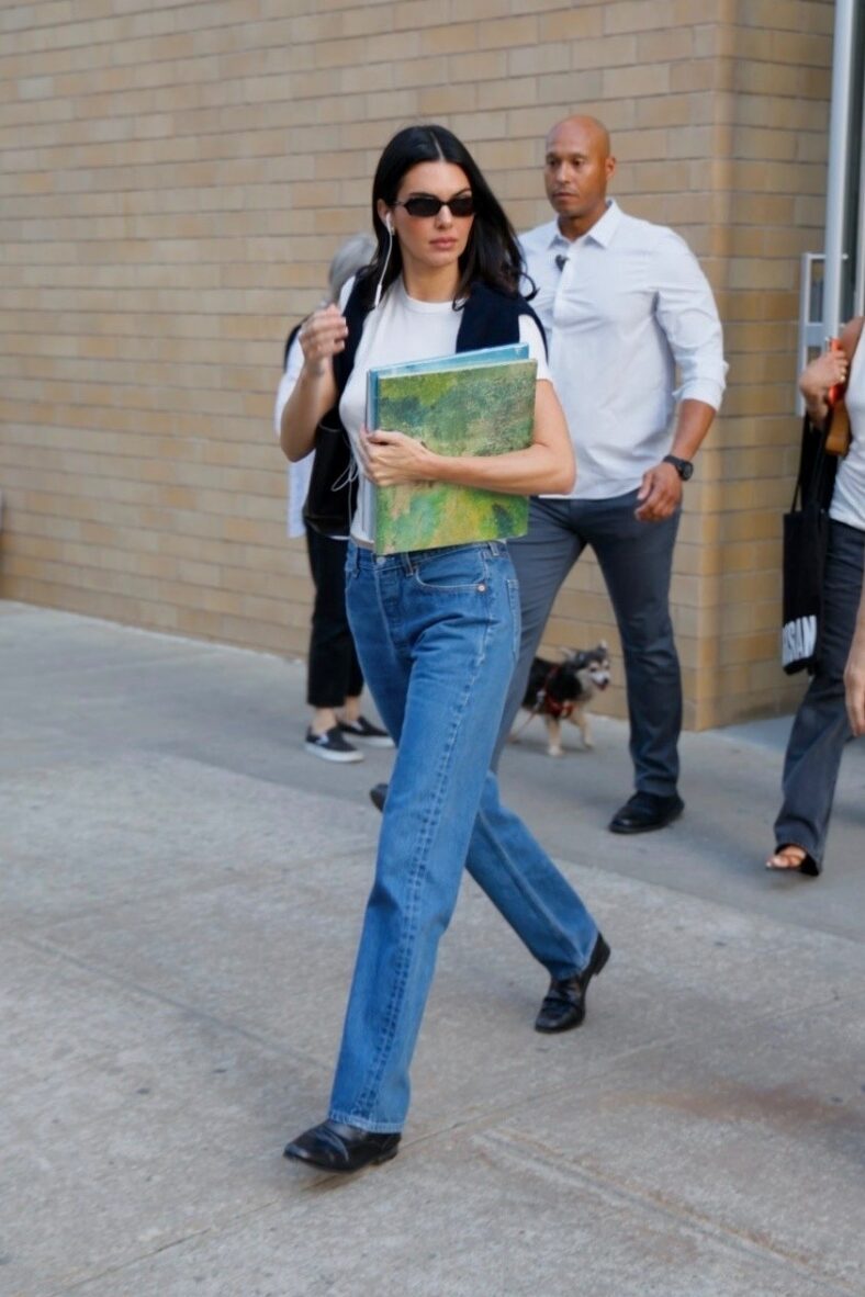 Kendall Jenner in white top and blue jeans