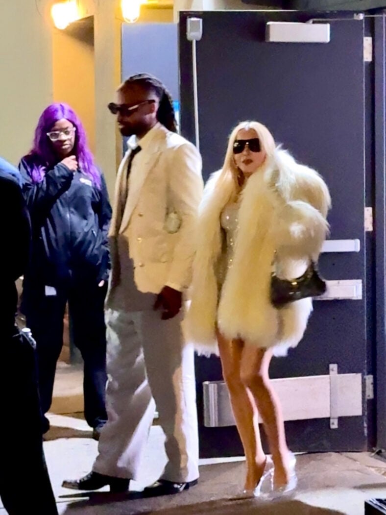 Akeem Morris and Madonna walking hand-in-hand