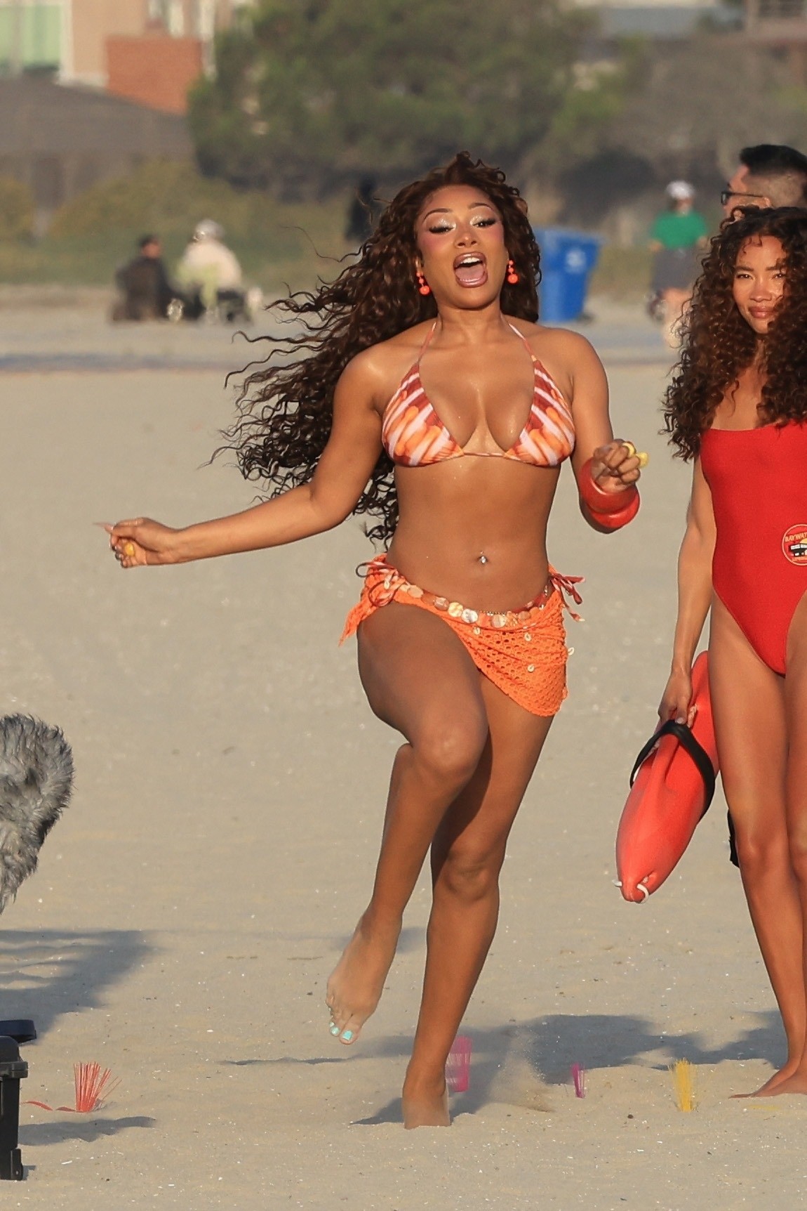 Megan thee Stallion films iconic "Baywatch" beach run