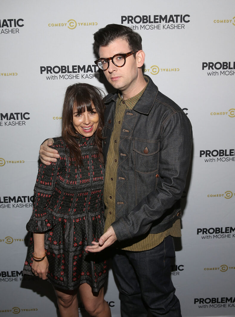 Moshe Kasher poses on red carpet with wife Natasha Leggero