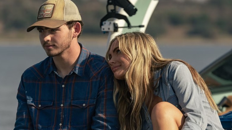 Oreana (Natalie Alyn Lind) cuddling into Carter (Finn Little) on 