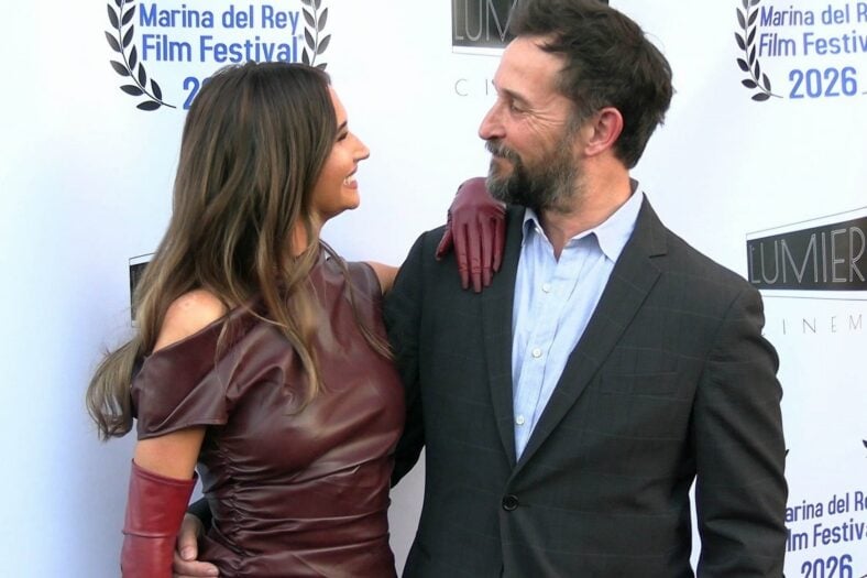 Auden and Noah Wyle smile at each other at The Vanishing Tour premiere