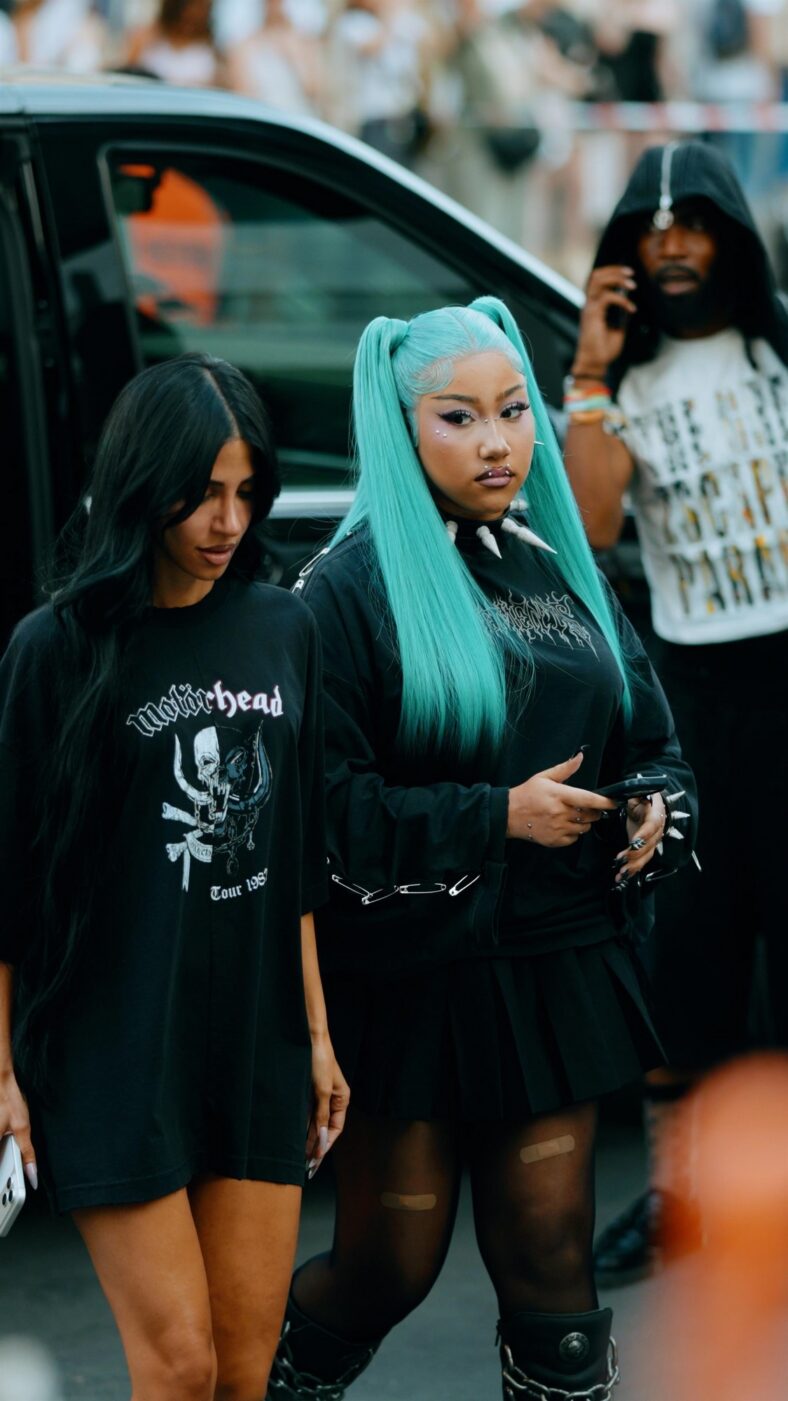 North West wears black grunge outfit with her long blue hair in high pigtails.