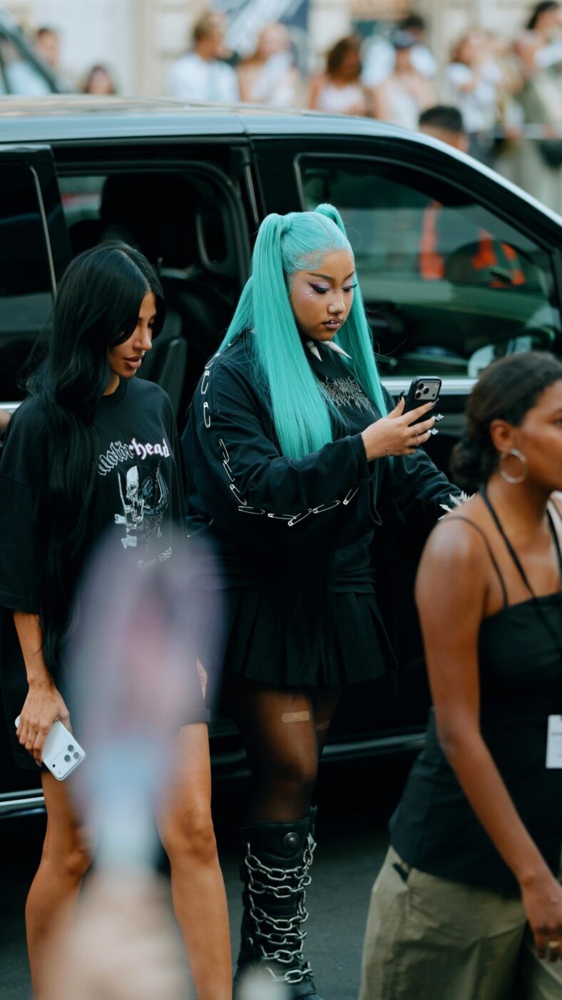 North West wears black grunge outfit with her long blue hair in high pigtails.