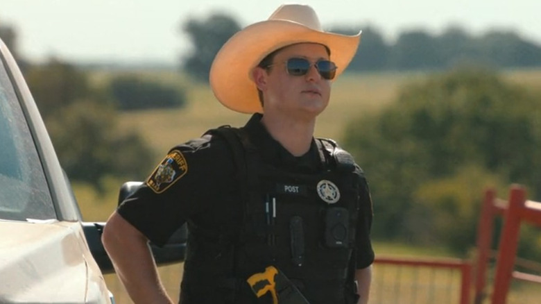 Deputy Cecil Post (Cooper Tomlinson) wearing a cowboy hat in Dutton Ranch
