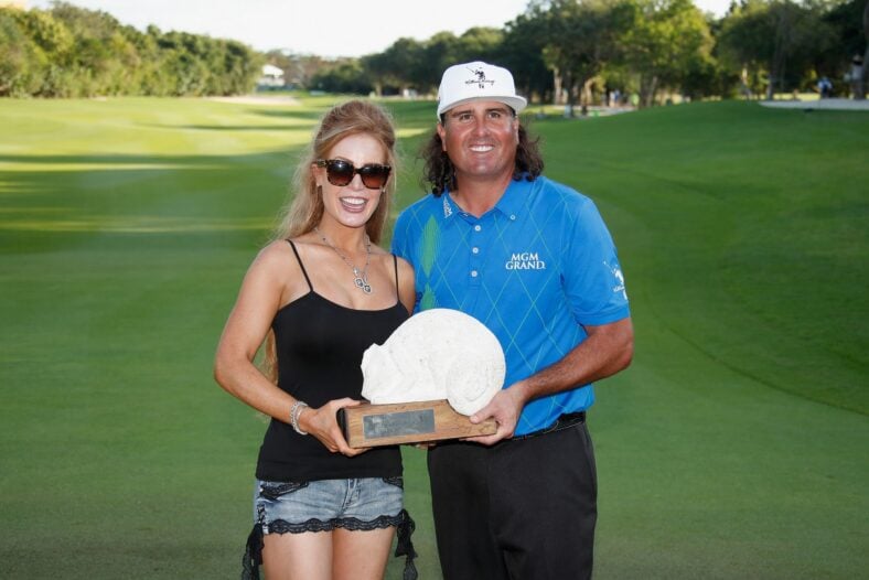 Pat Perez of the United States poses with his wife Ashley and the 2016 Champion's Trophy 