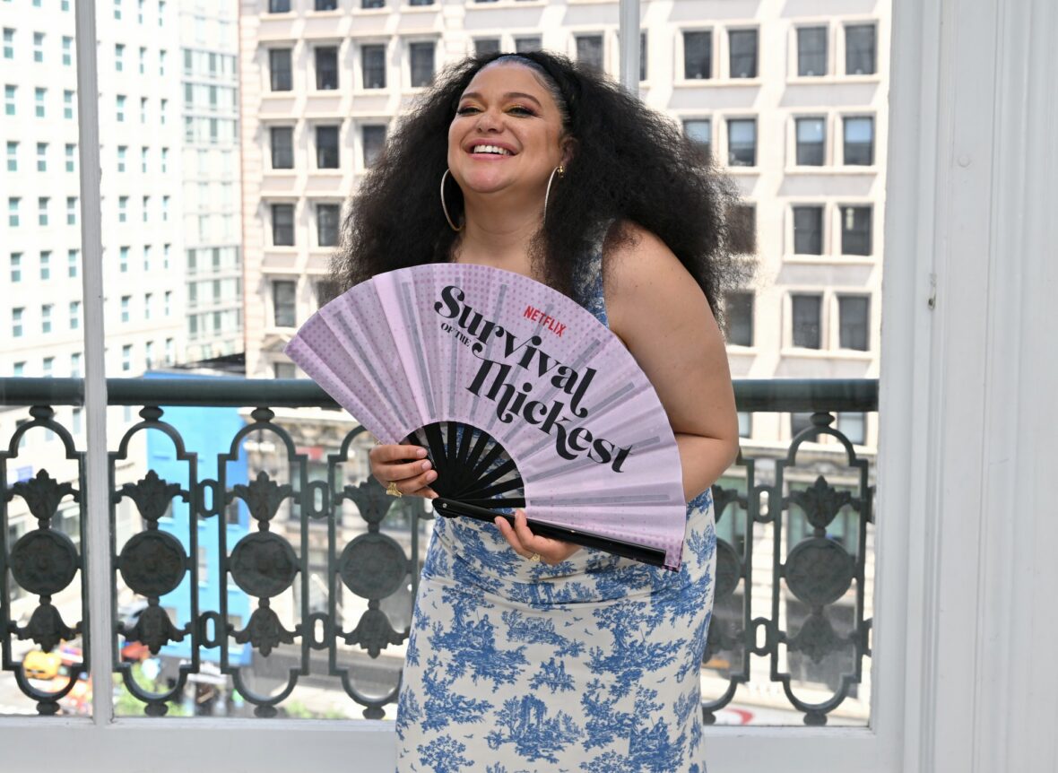 Michelle Buteau poses with a fan at NYC Pride drag brunch
