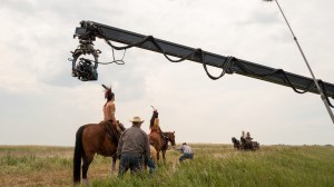 Little House on the Prairie. (L to R) Xander Cole as Little Puma, Corvin Mack as Myron, Crosby Fitzgerald as Caroline Ingalls, Luke Bracey as Charles Ingalls in episode 103 of Little House on the Prairie. Cr. Eric Zachanowich/Netflix © 2026