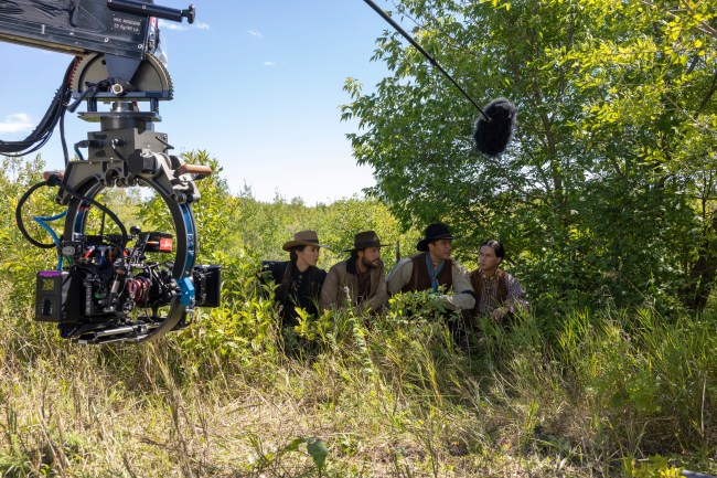 Little House on the Prairie. (L to R) Rebecca Amzallag as Lacey, Luke Bracey as Charles Ingalls, Meegwun Fairbrother as Mitchell, Xander Cole as Little Puma in episode 105 of Little House on the Prairie. Cr. Eric Zachanowich/Netflix © 2026