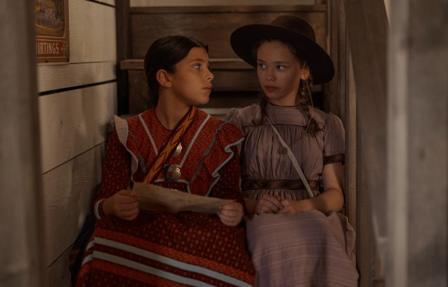 Little House on the Prairie. (L to R) Wren Zhawenim Gotts as Good Eagle, Alice Halsey as Laura Ingalls in episode 107 of Little House on the Prairie. Cr. Eric Zachanowich/Netflix © 2026